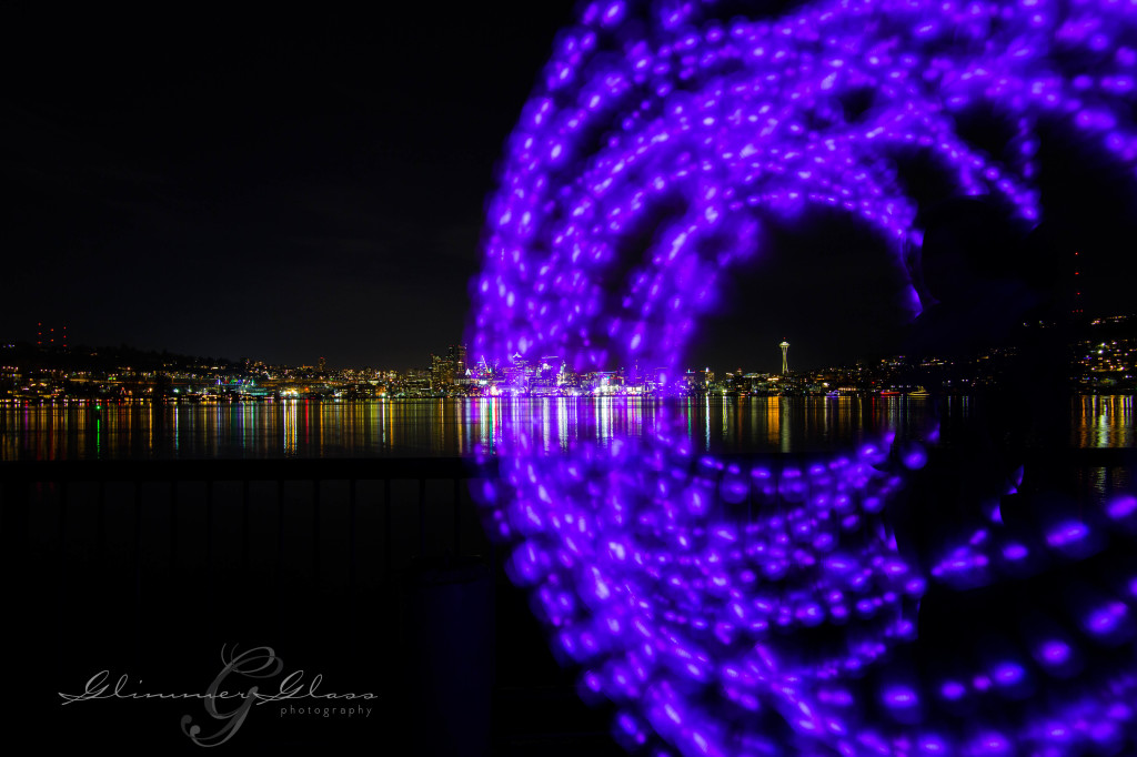 Brie swinging the Poi Pods at long exposure on the waterfront of Gasworks Park. New Year's Day, 2015